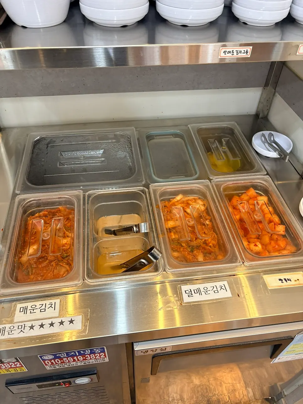 Water and kids' spoon and fork at the self-serve bar