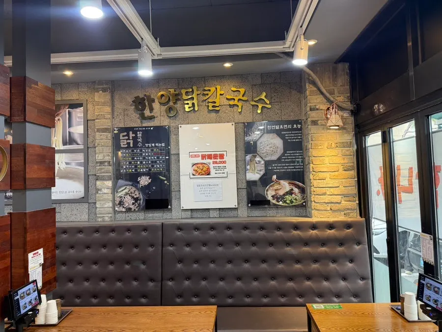 Interior with gray walls and wood-toned furniture