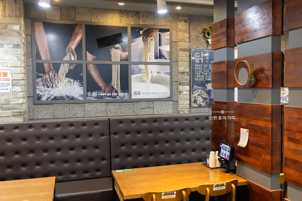 Wooden tables and gray sofa-style seating