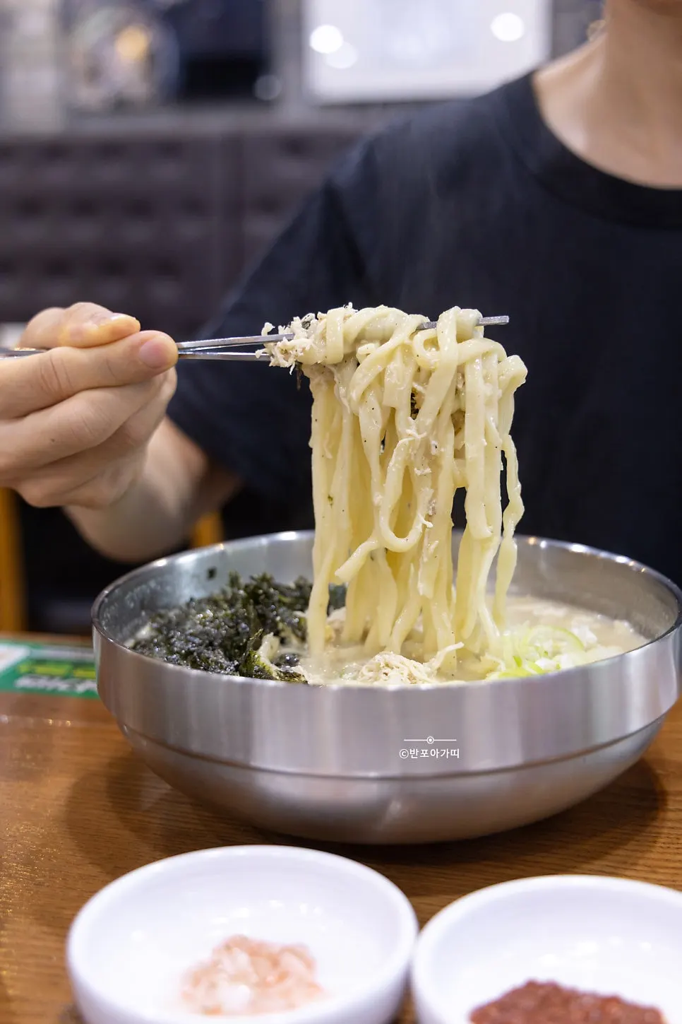 Thick kalguksu noodles lifted up