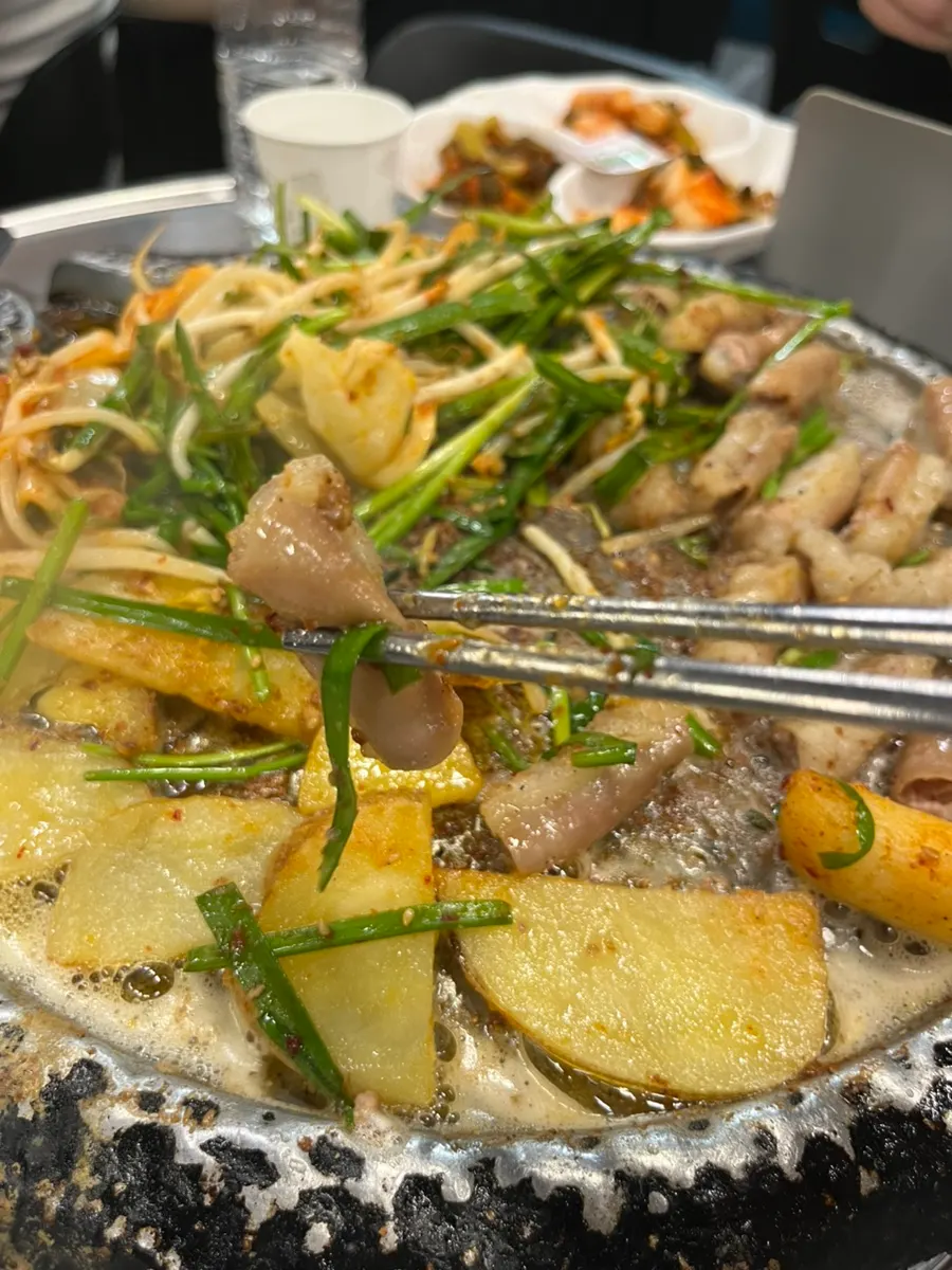 Staff grilling beef gopchang on the grill