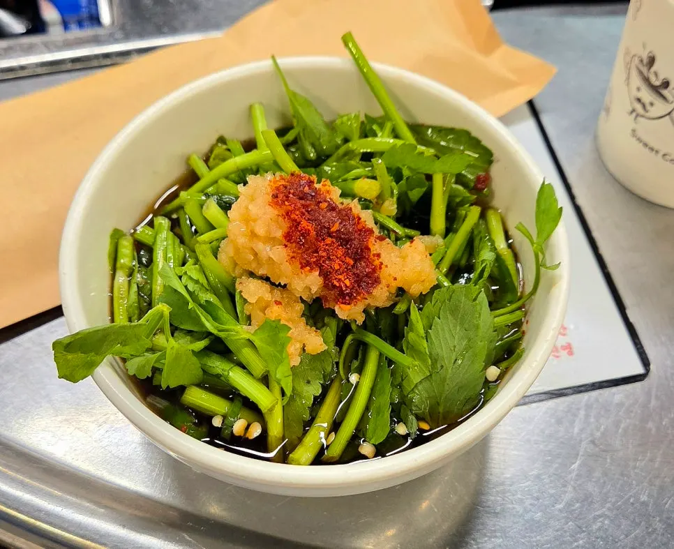 Plate of scallion kimchi and mustard leaf kimchi