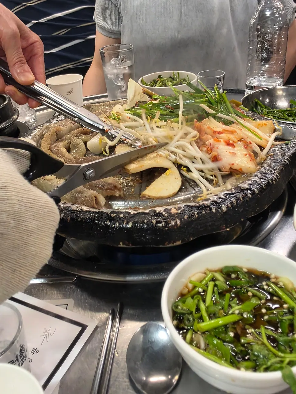 Staff member grilling beef gopchang