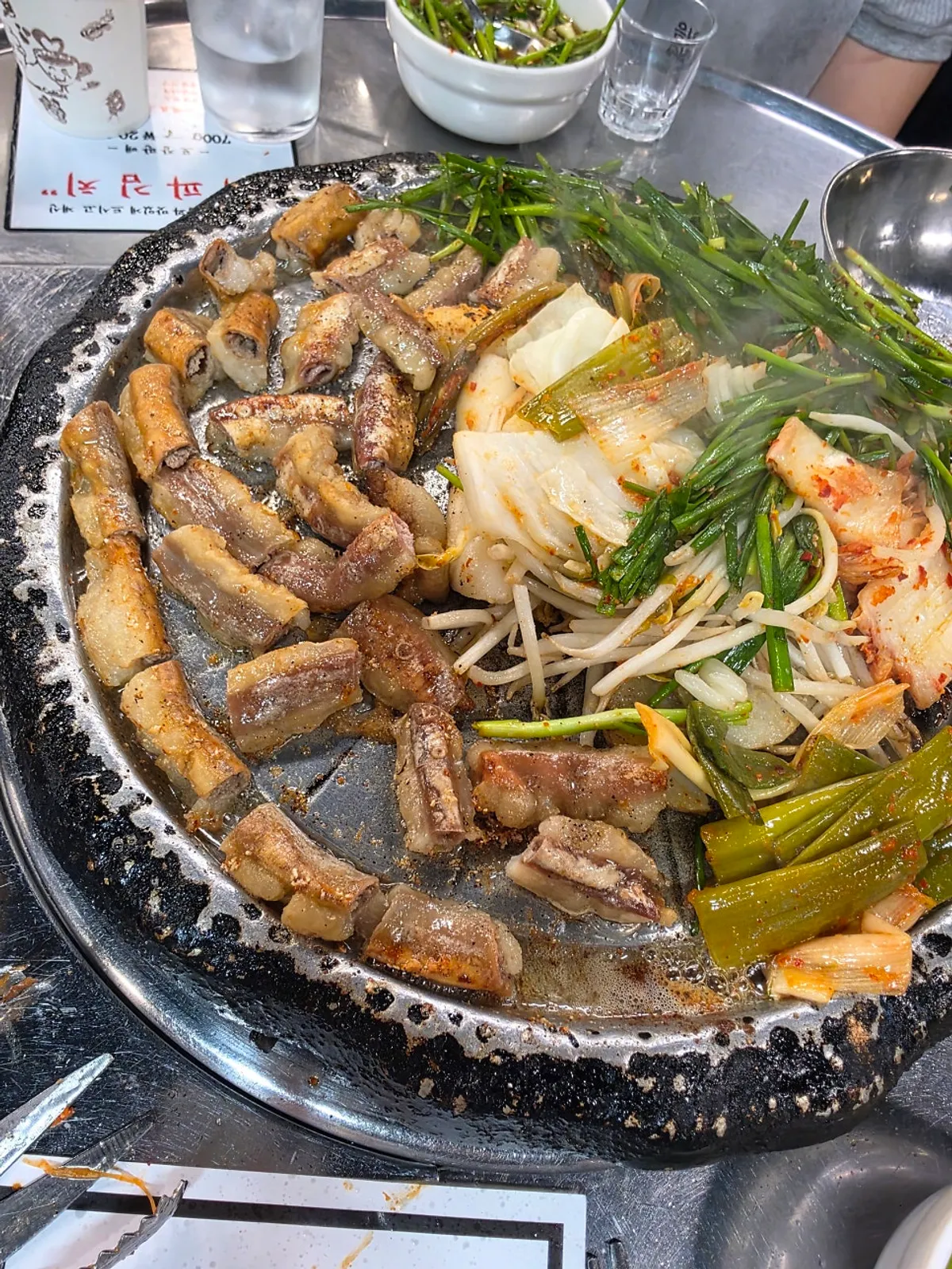 Finished beef gopchang and grilled vegetables