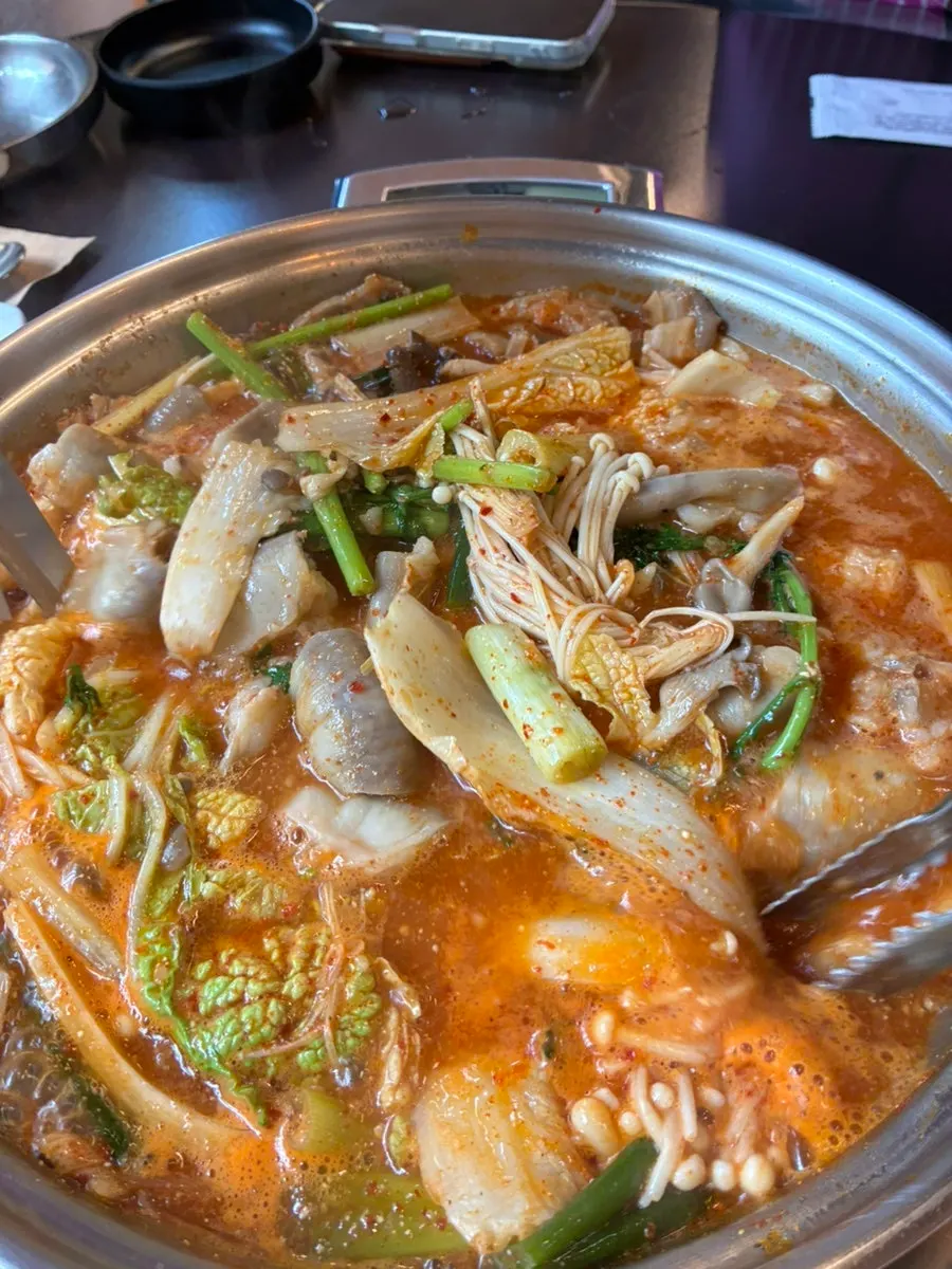 Gopchang hot pot with cabbage kimchi
