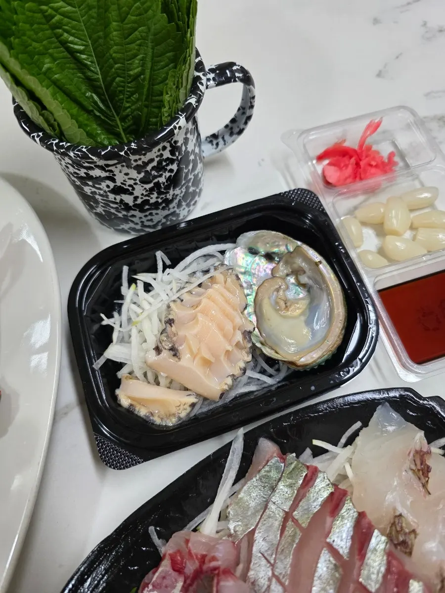 Complimentary abalone served as a side