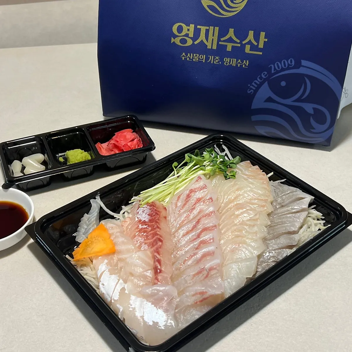 Live fish sashimi packed by Yeongjae Susan