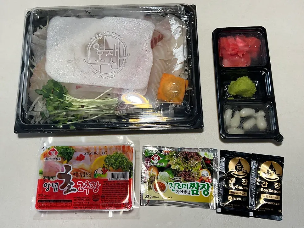 Sashimi takeaway and accompanying sauces