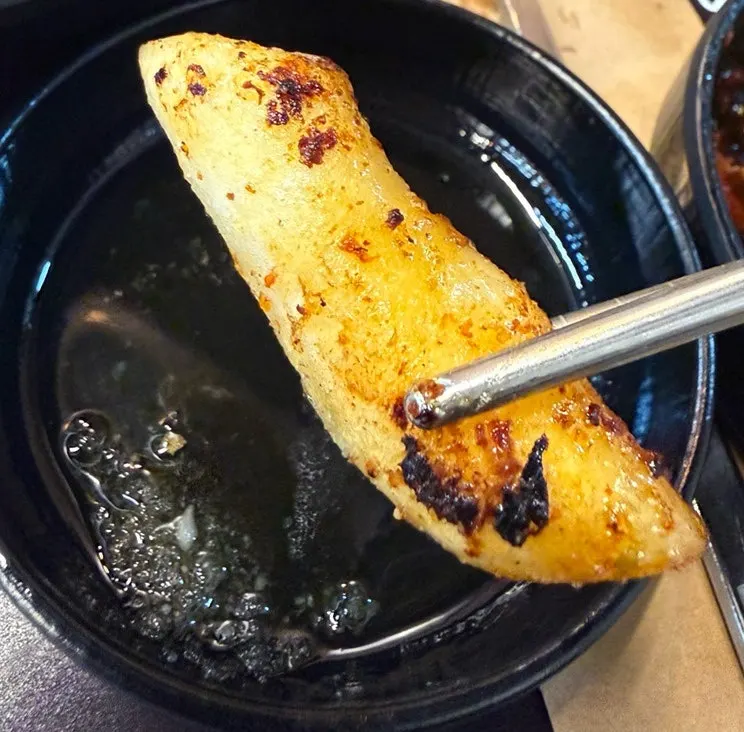 Golden-brown grilled potato and garaetteok
