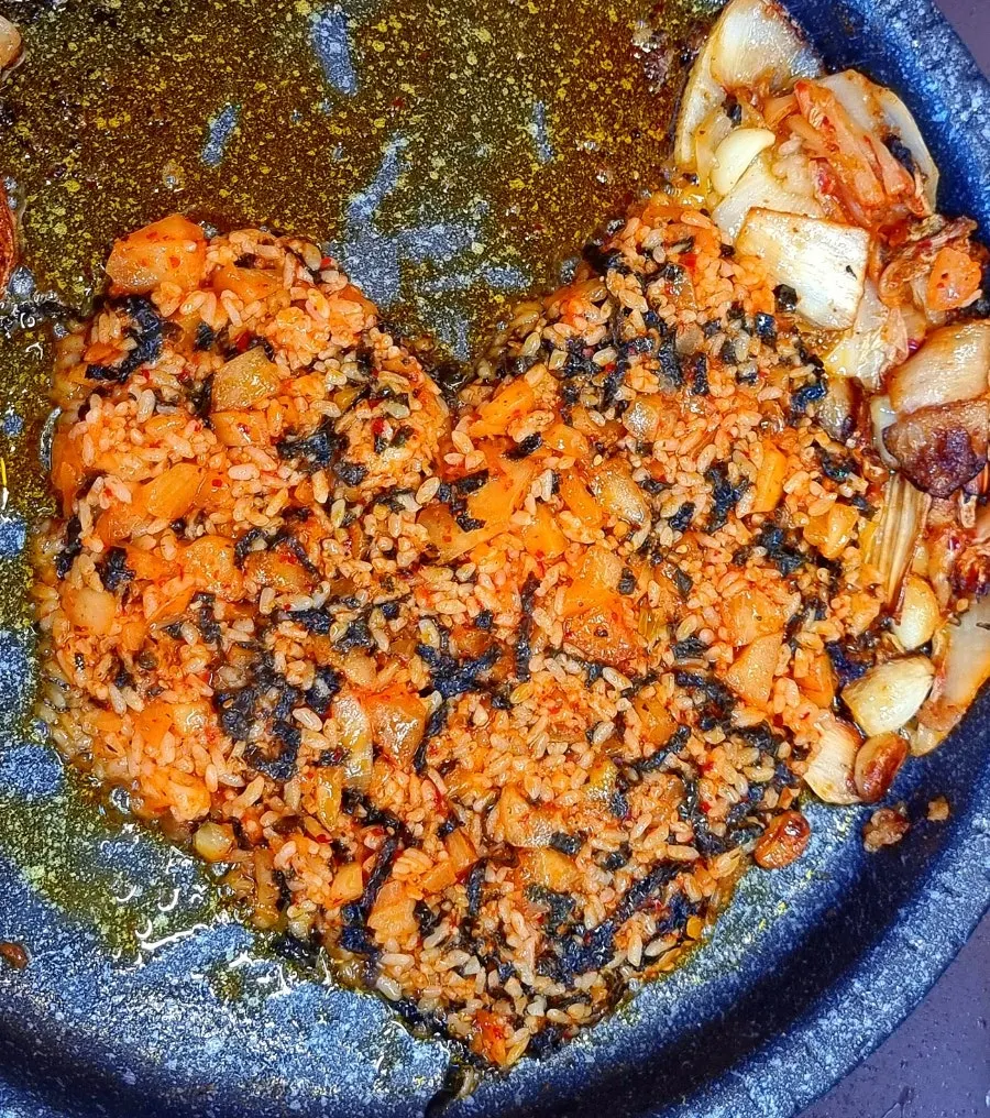 A golden-grilled piece of gopchang and daechang