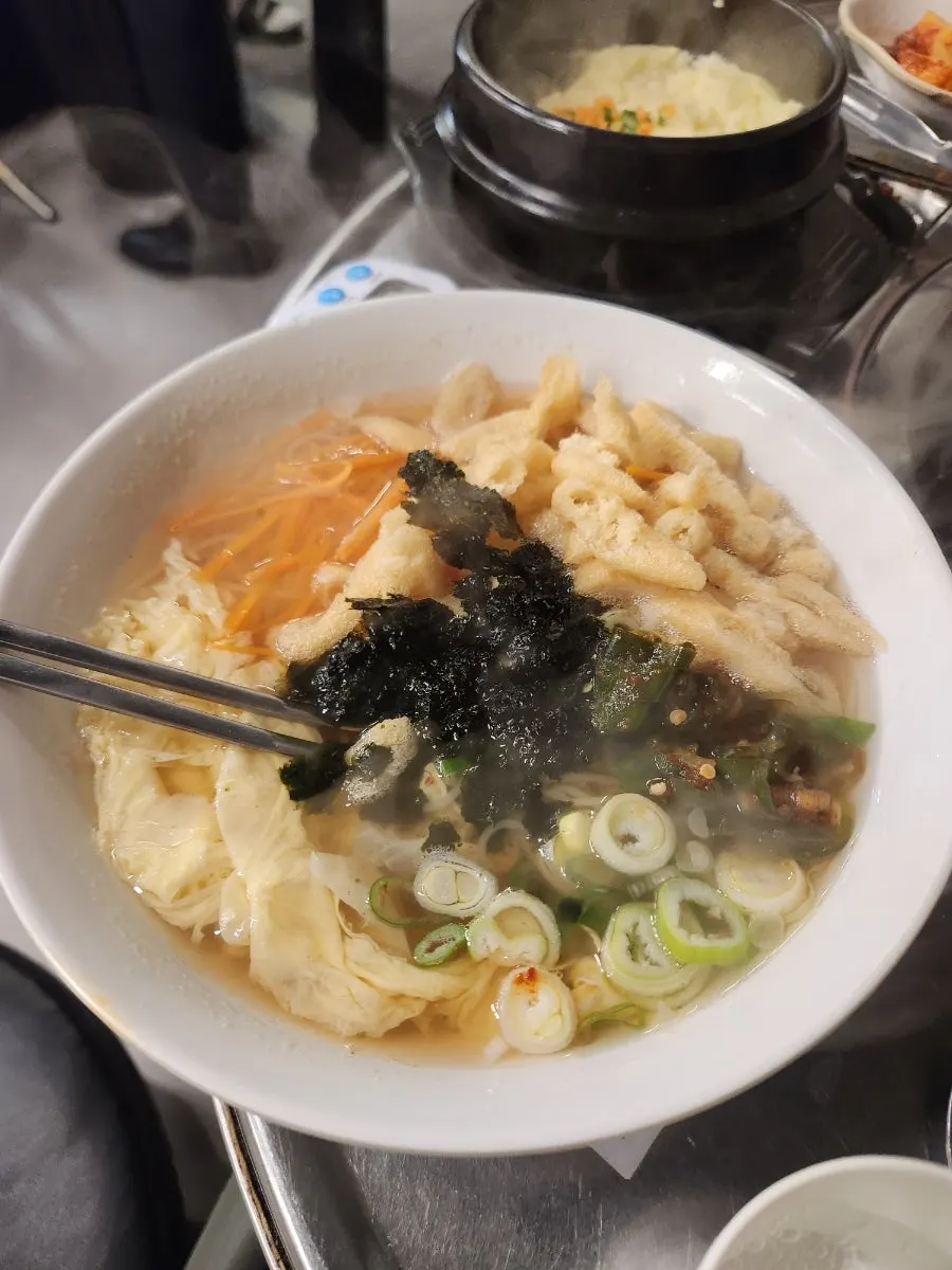 Warm anchovy noodles ordered alongside the gopchang
