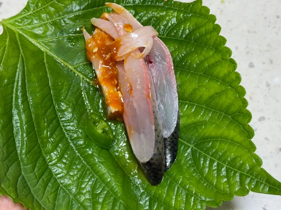 First piece of gizzard shad sashimi picked up