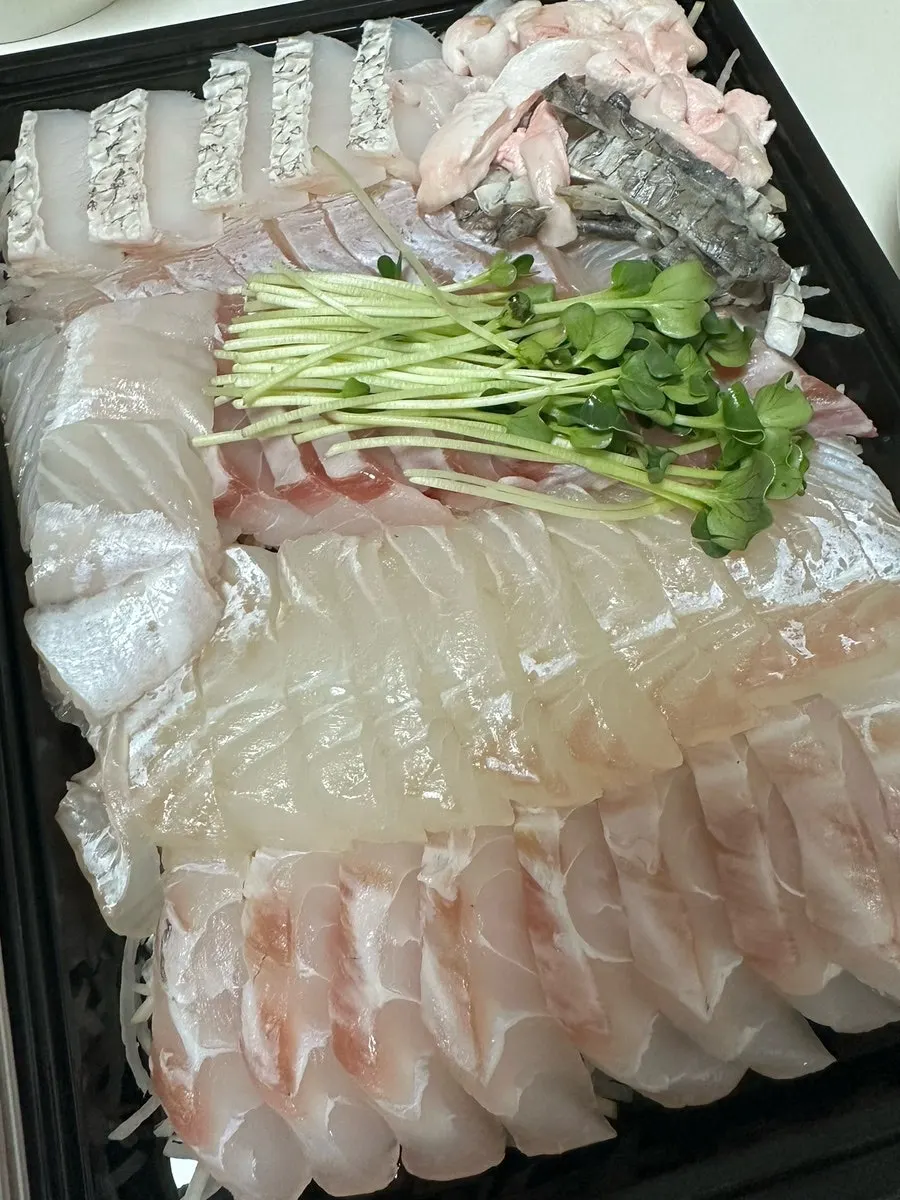Fish stew ingredients included with the sashimi order