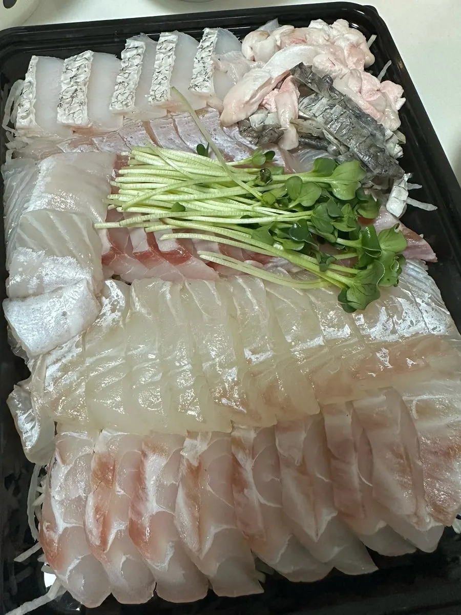 Fish stew fixings with radish and bean sprouts