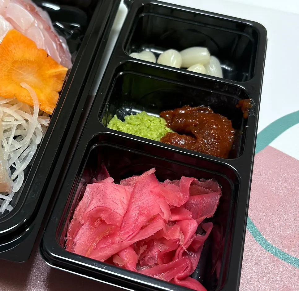 Boiled fish stew served alongside the sashimi spread