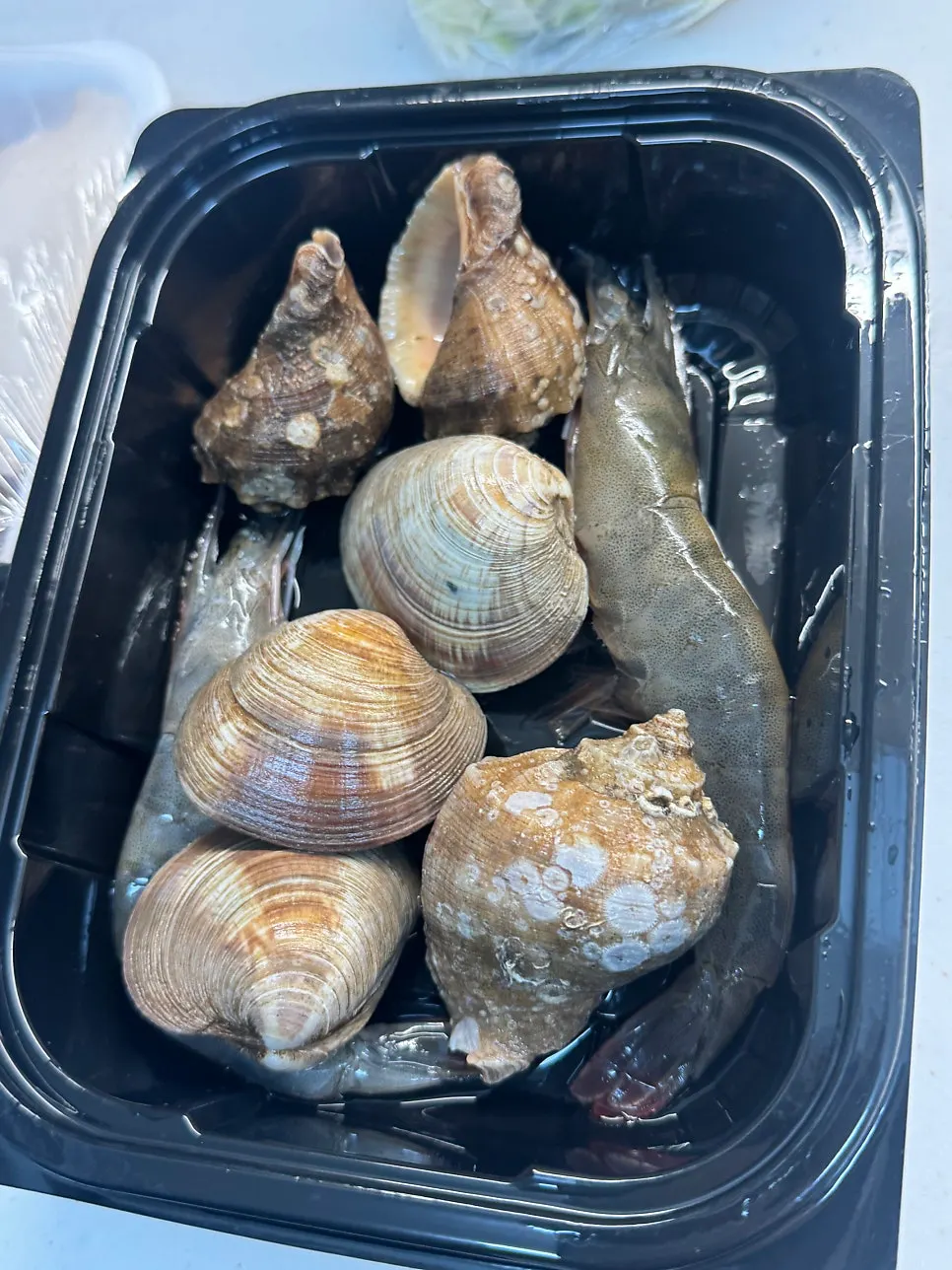 Maeuntang kit loaded with clams, whelk, and shrimp