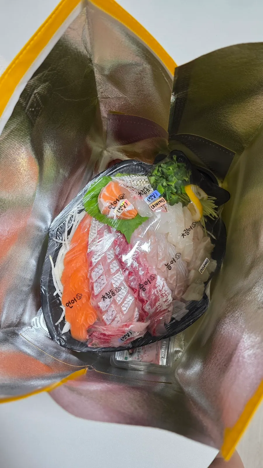 Premium mixed sashimi platter with name tags on each cut