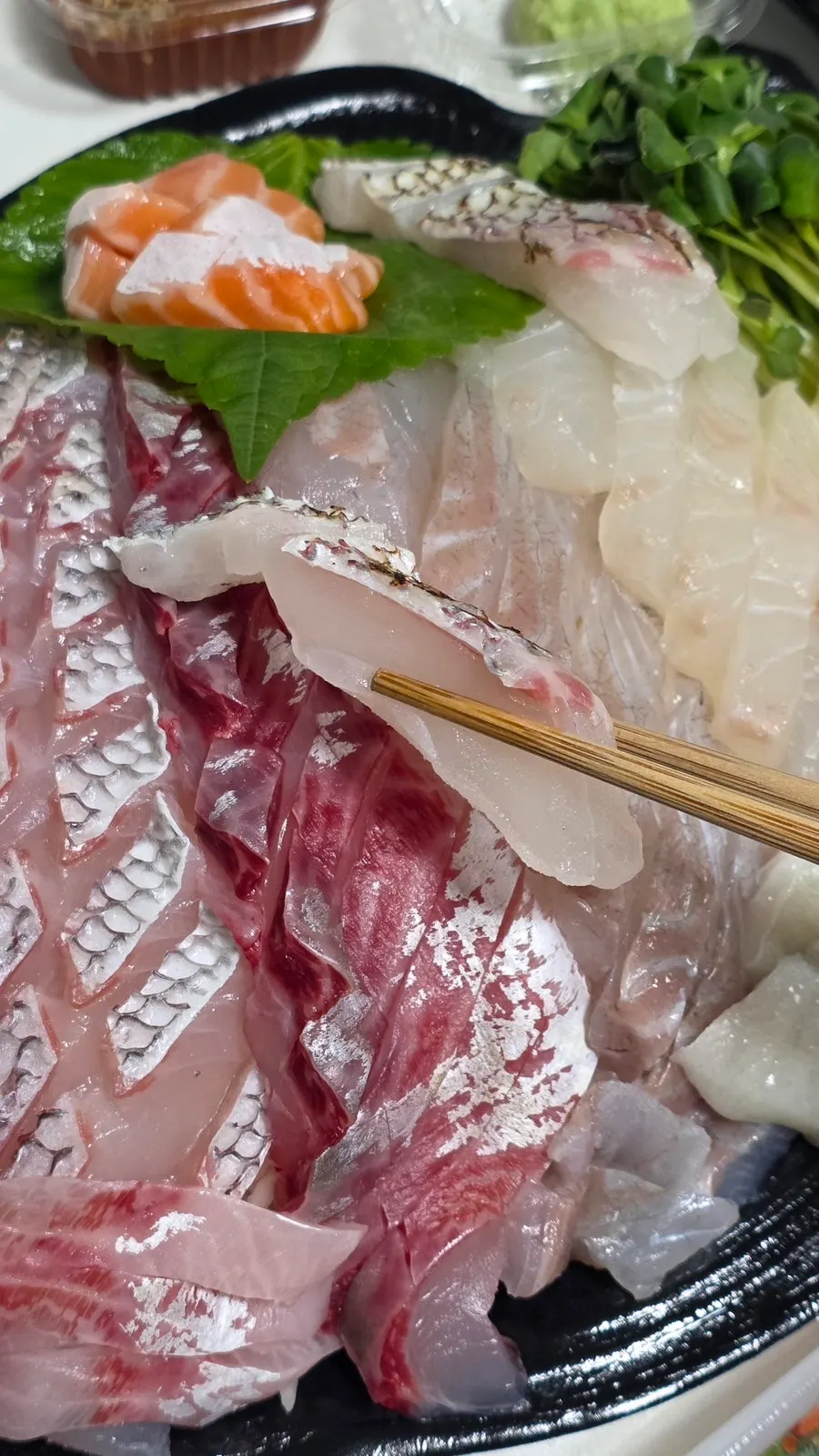 Premium mixed sashimi platter transferred onto a plate