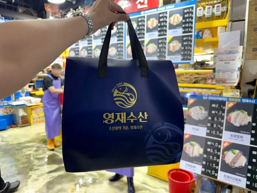 Neatly packed bag of sashimi from Yeongjae Susan