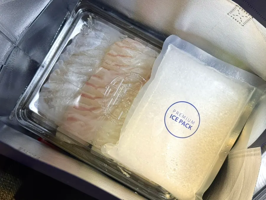 Inside the sashimi takeout bag with an ice pack included