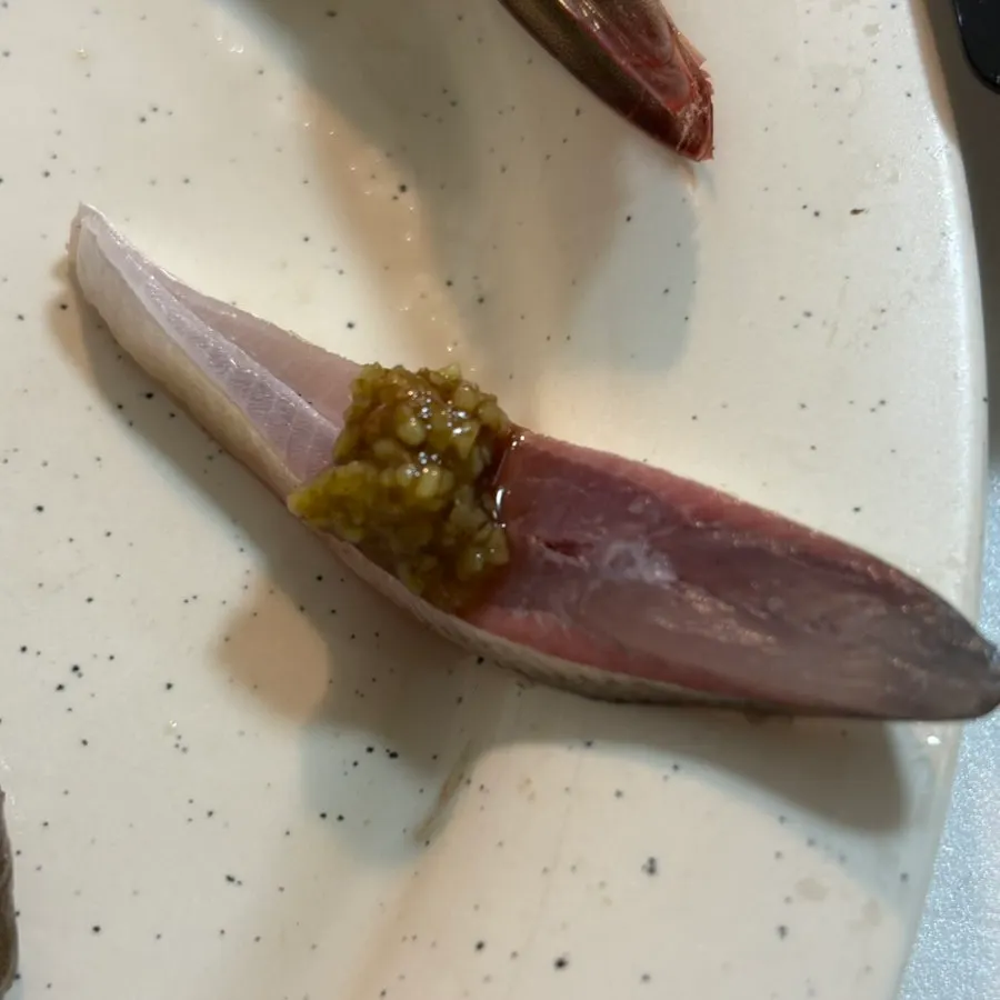 Close-up of gizzard shad sashimi with silvery skin