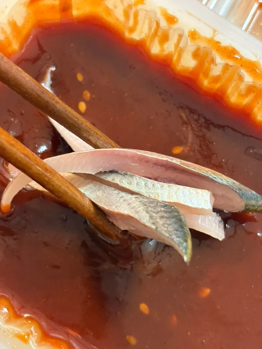 Prepared live shrimp alongside assorted sashimi