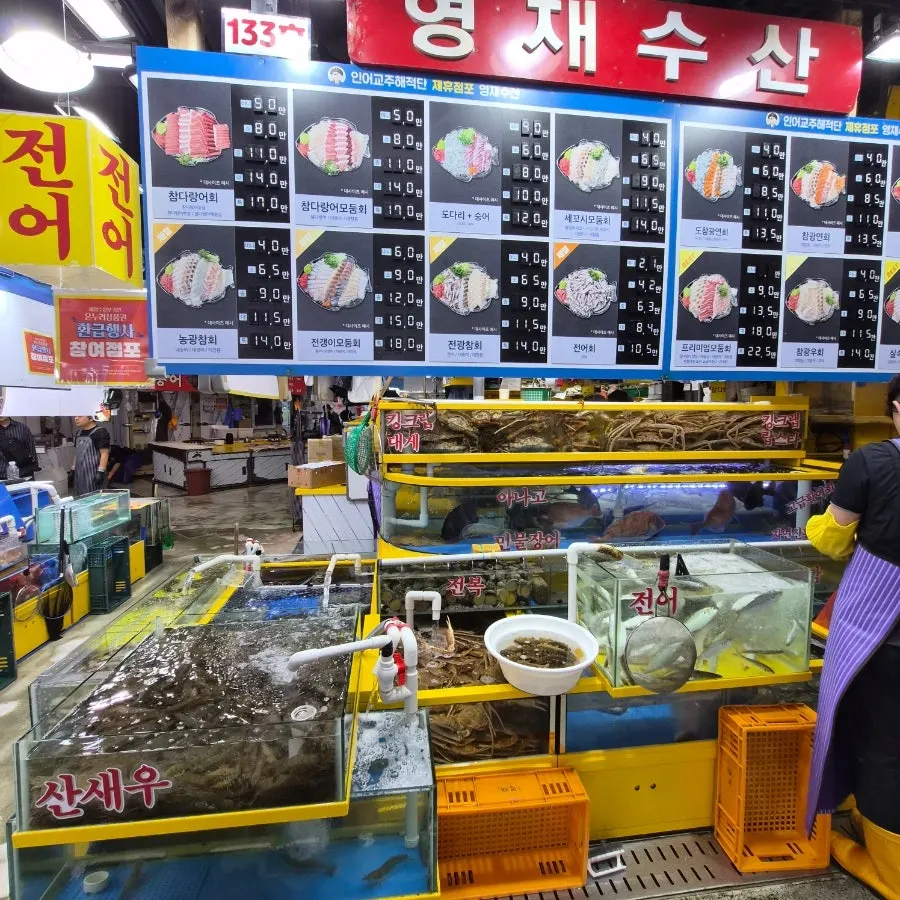 Aisle inside the seafood market at Garak Mall's sales building