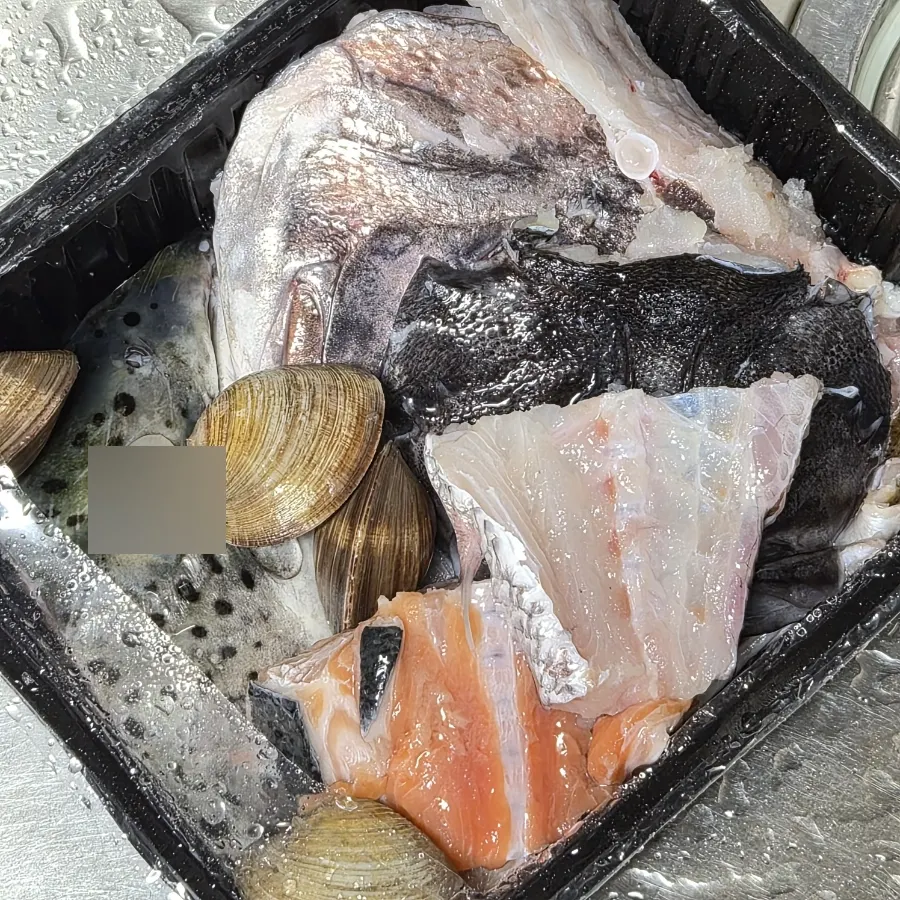 Packed sashimi and fish stew ingredients
