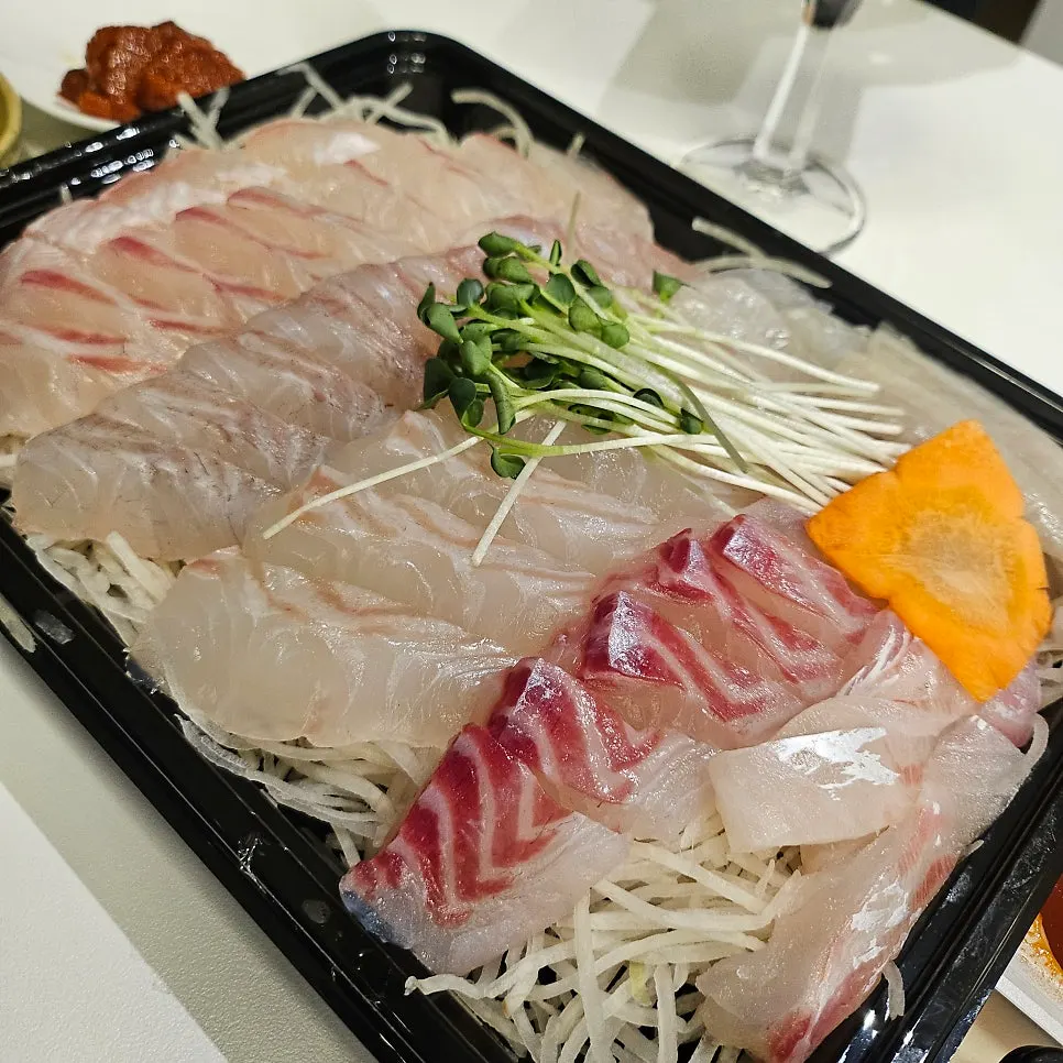 Assorted sashimi packed inside the container