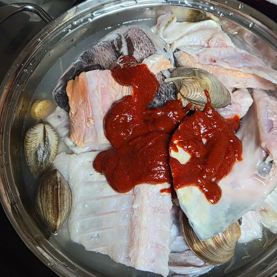 A pot of fish stew cooked at home