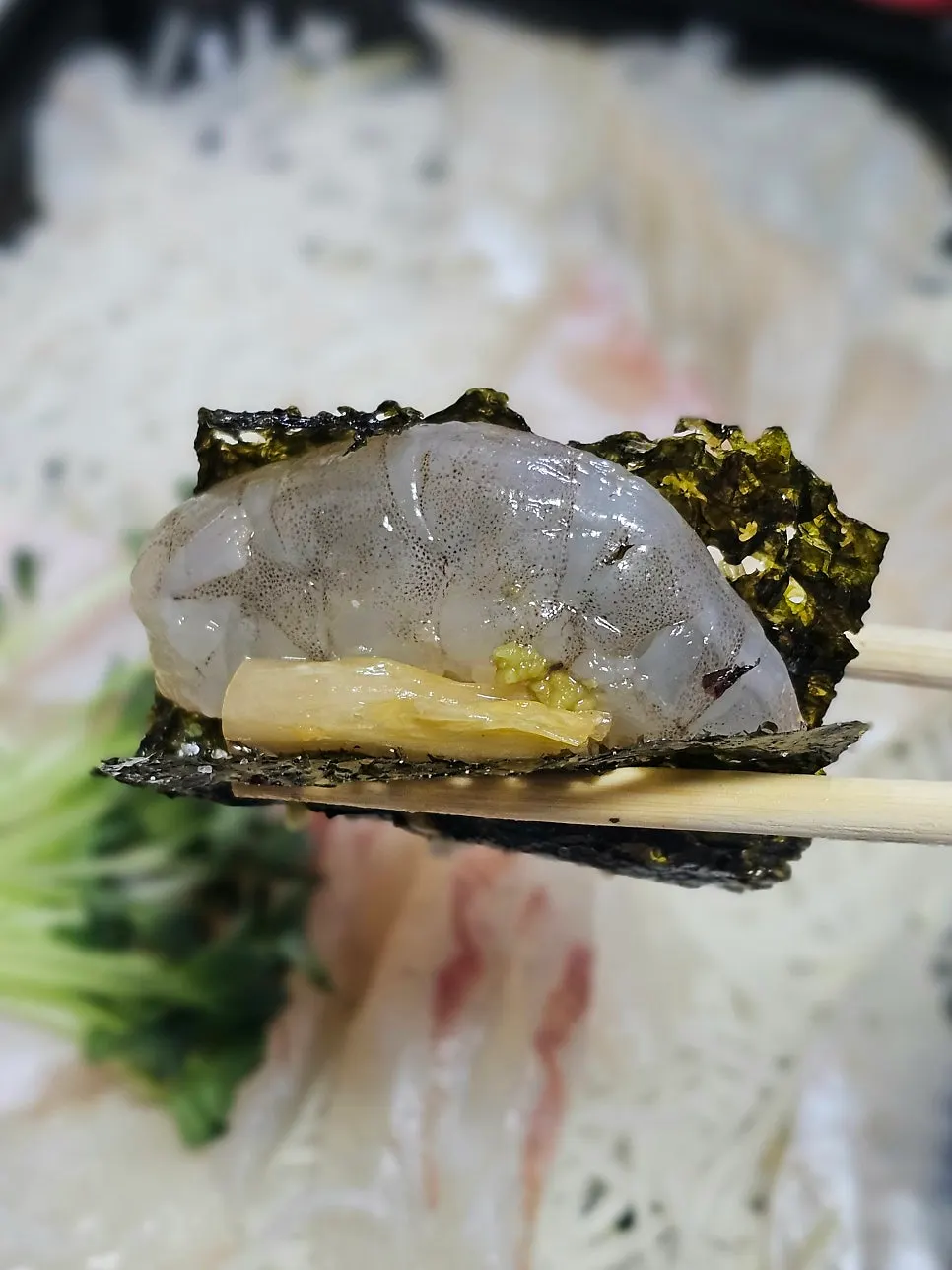 Vertical shot of packed sashimi from Yeongjae Susan