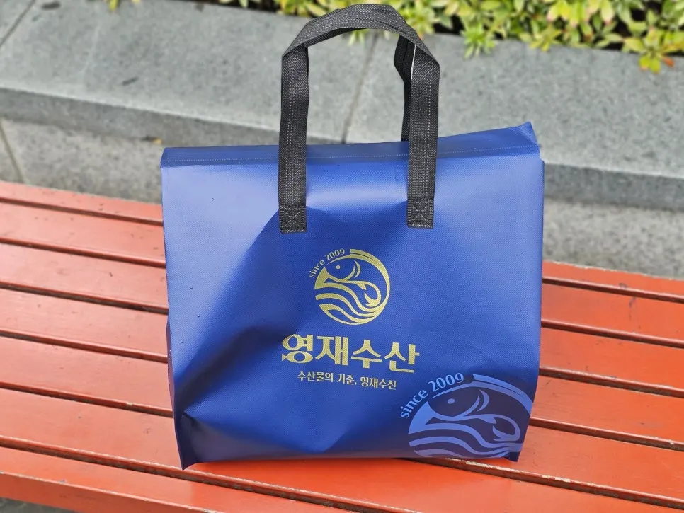 Cooler bag packed with sashimi and seafood