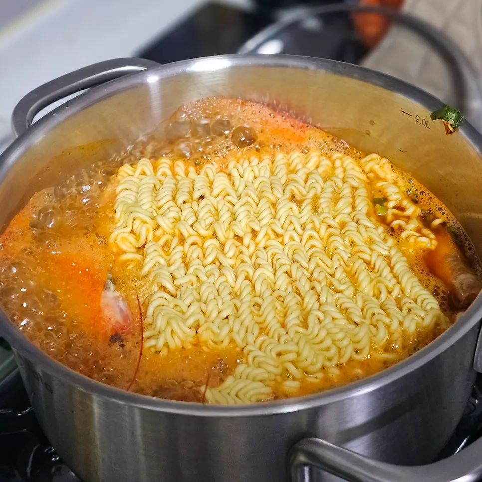 A plate of nutty, pan-fried shrimp heads in butter