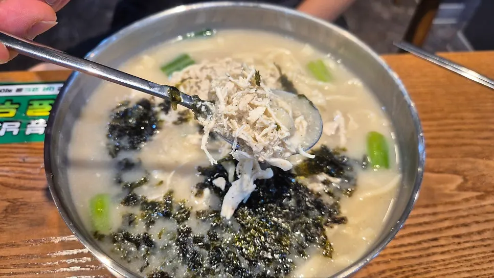 A bowl of chicken kalguksu with rich broth