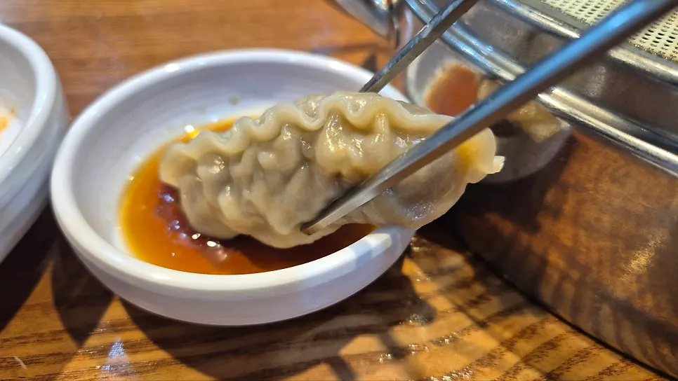Chicken kalguksu broth with laver topping