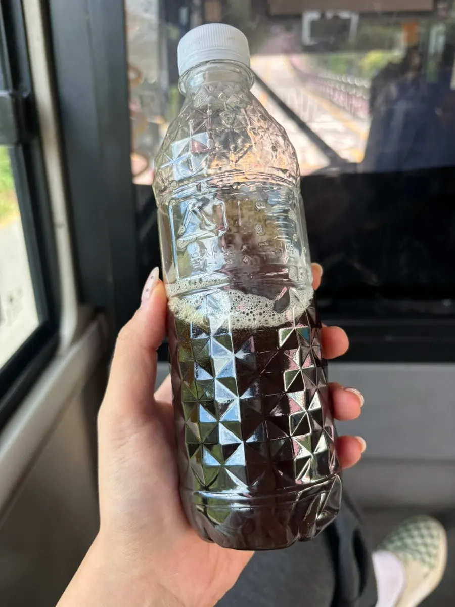 A cup of dark Americano flavor mixed with cold water