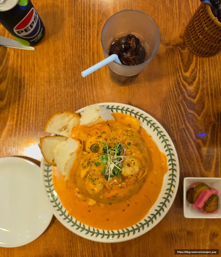 Table setting with shrimp rosé pane and zero-sugar cola