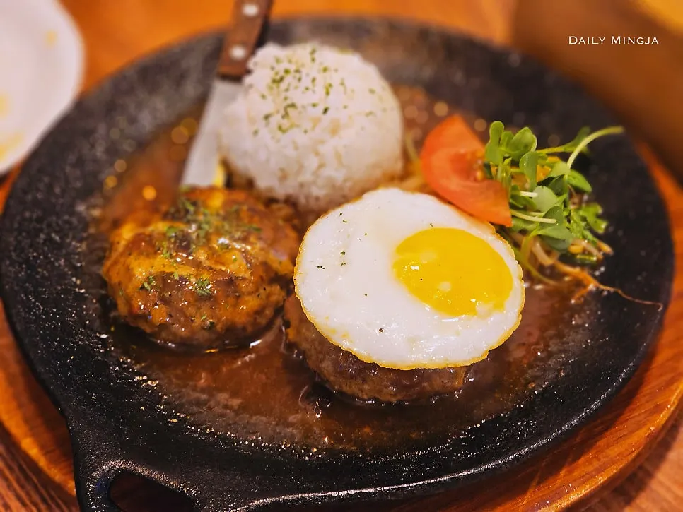 Cross-section of hamburg steak coated in demi-glace sauce