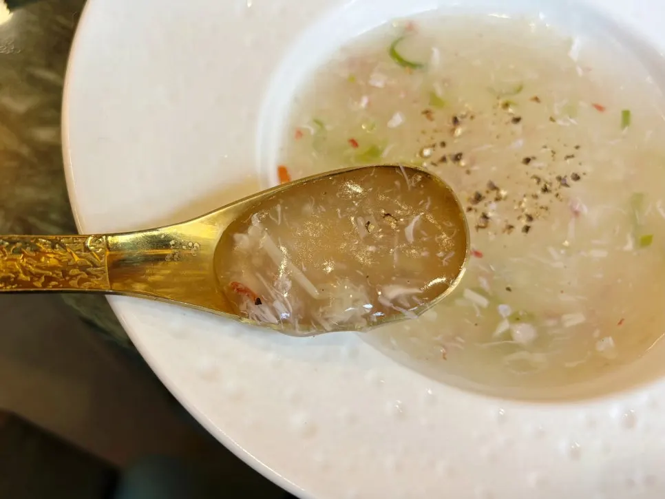 A bowl of rich crab meat soup