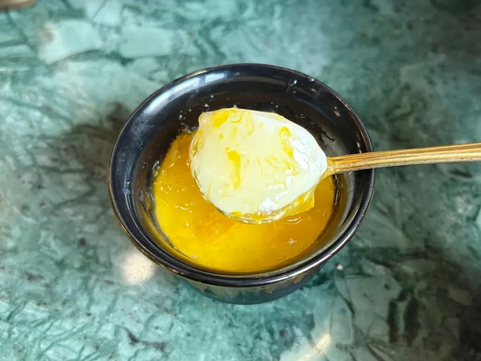Dessert topped with yuzu sauce