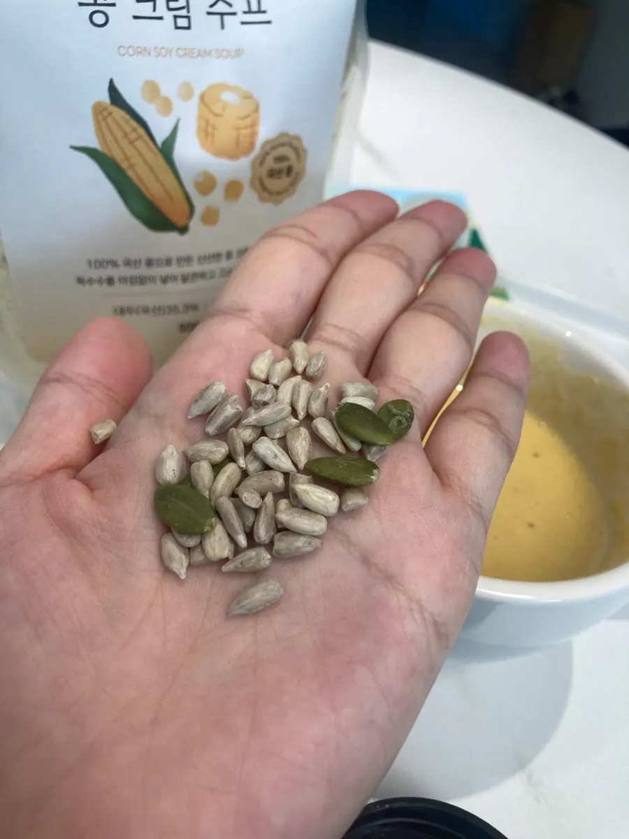 Breakfast substitute soup topped with sunflower and pumpkin seeds
