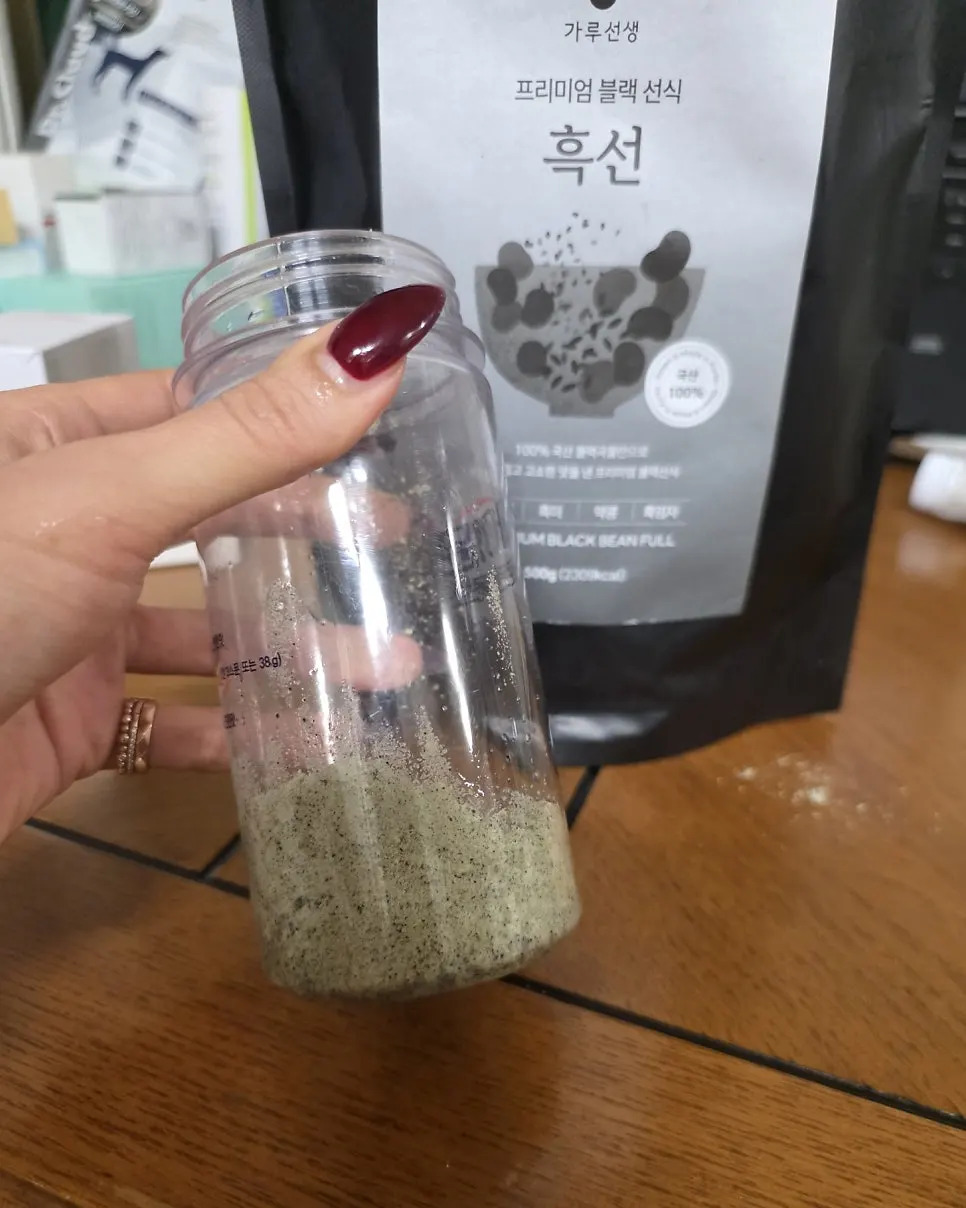Shaker with water added, before shaking the grain drink