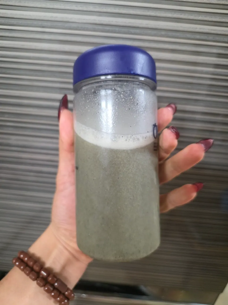 Grayish-brown Heukseon grain drink poured into a cup