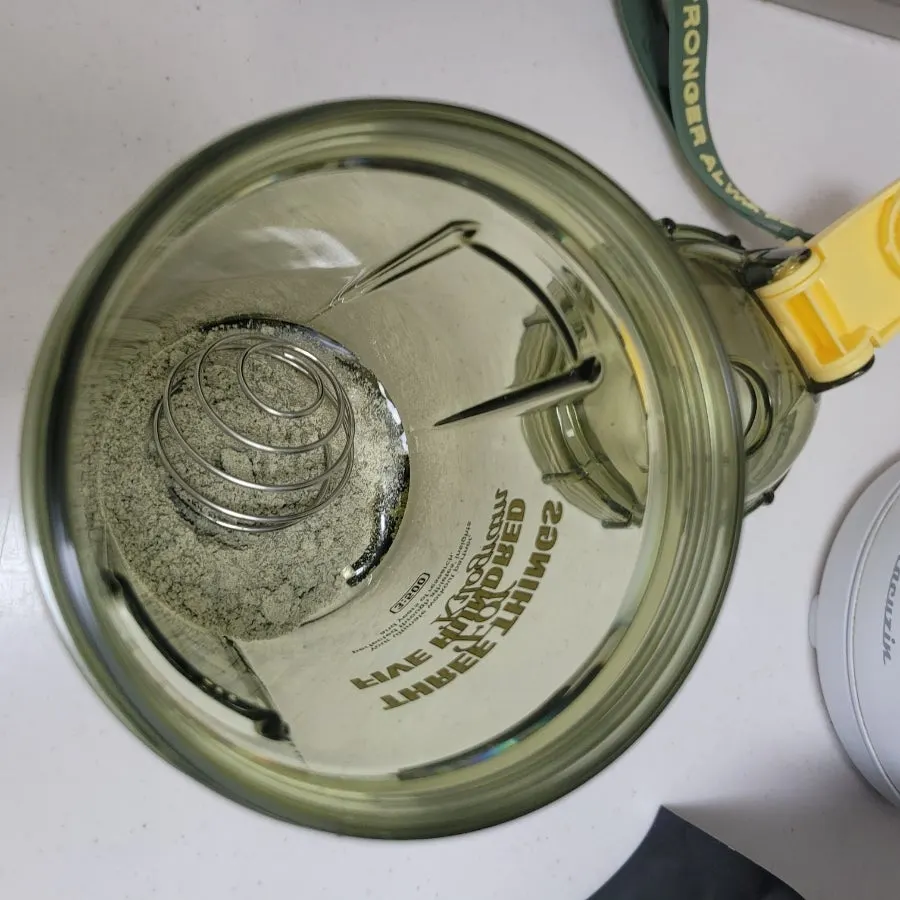 Mixing the grain powder in a shaker bowl