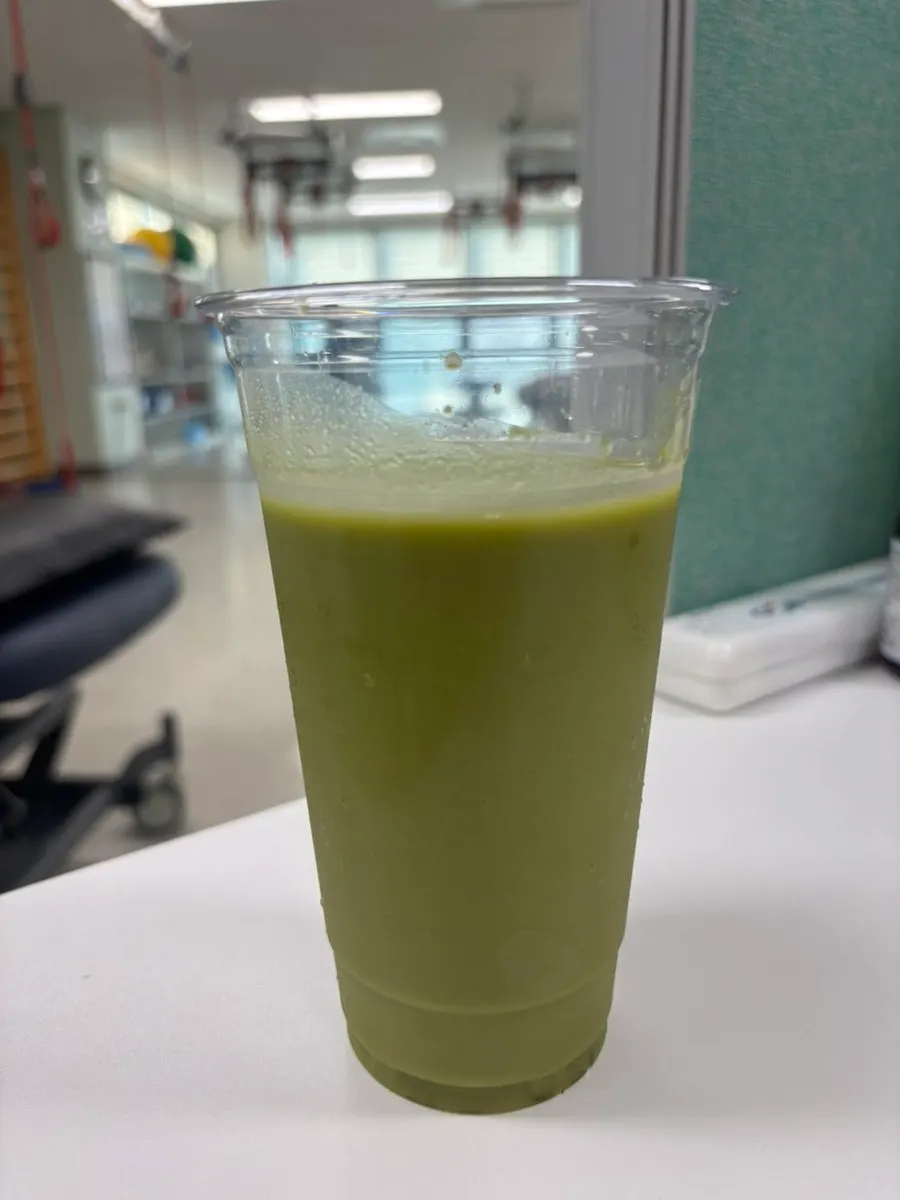 Matcha soy milk mixed with water for a morning drink