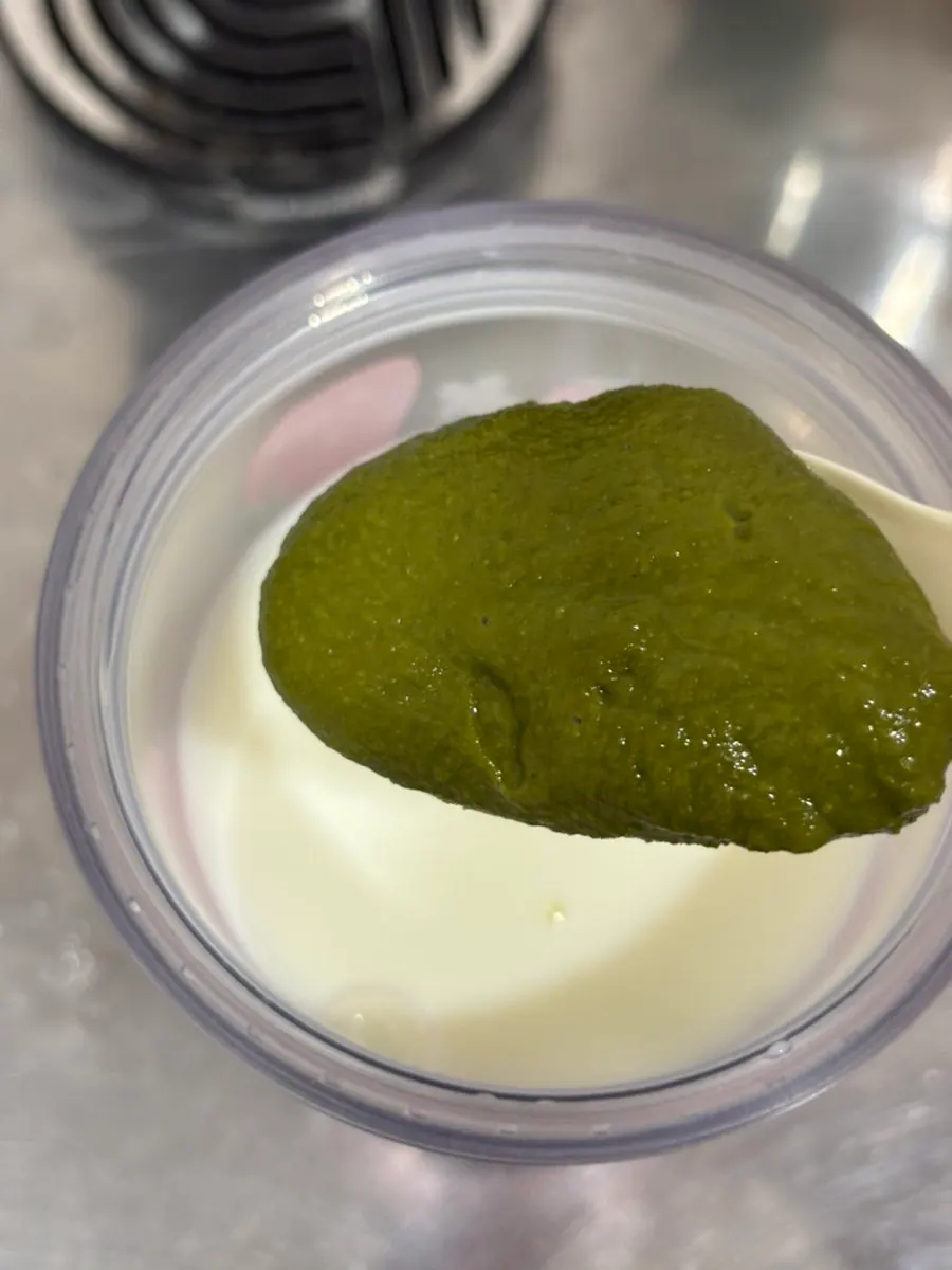 Matcha powder mixed into yogurt