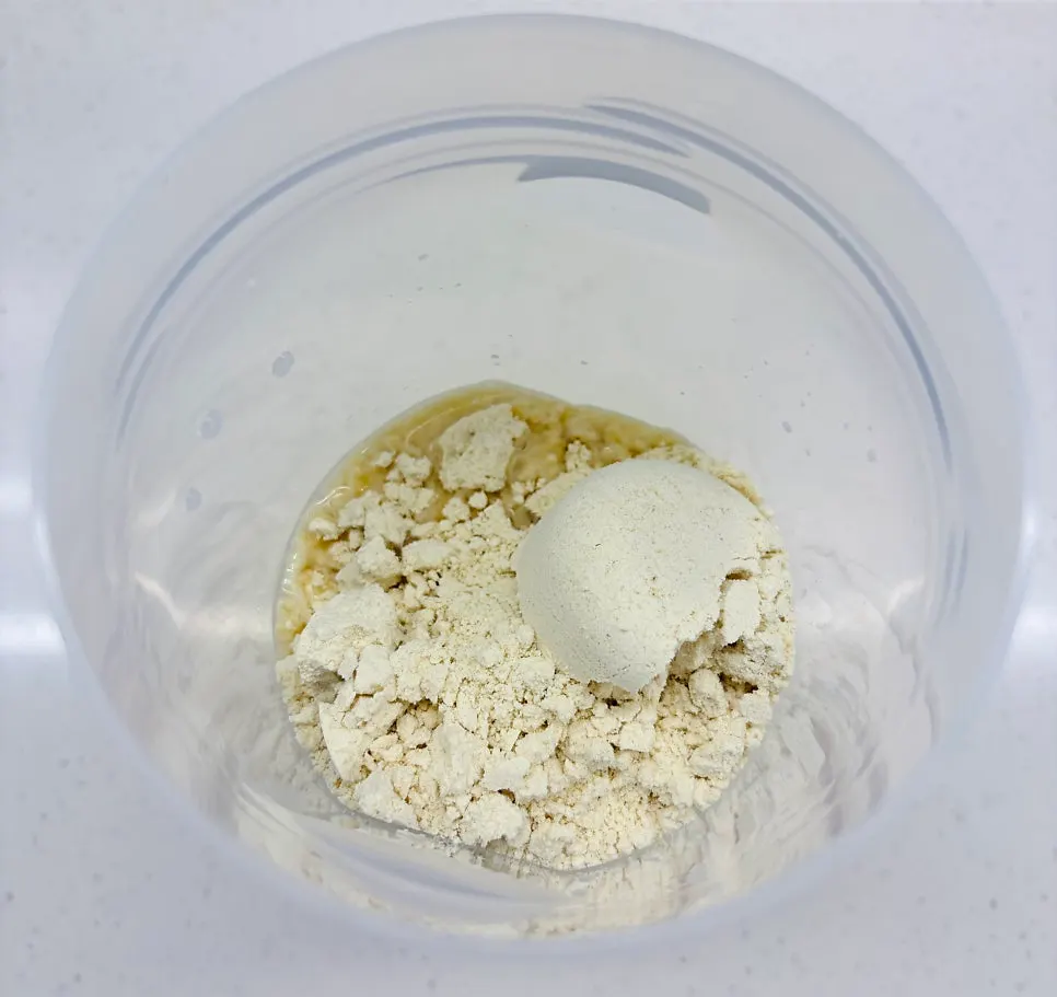 Two scoops of white soybean powder in water