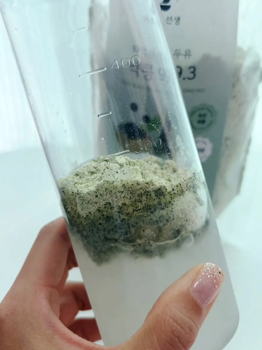 Shaking the yakkong soy milk powder in a shaker bottle