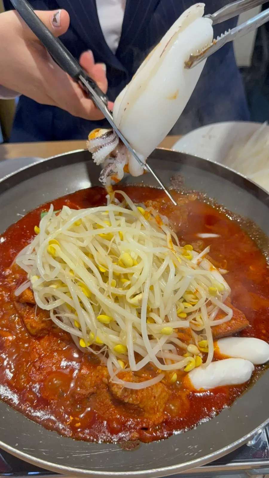 Rib meat falling off the bone next to soybean sprouts