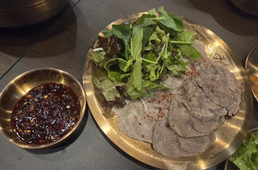 A piece of gomtang meat topped with nakji-jeot
